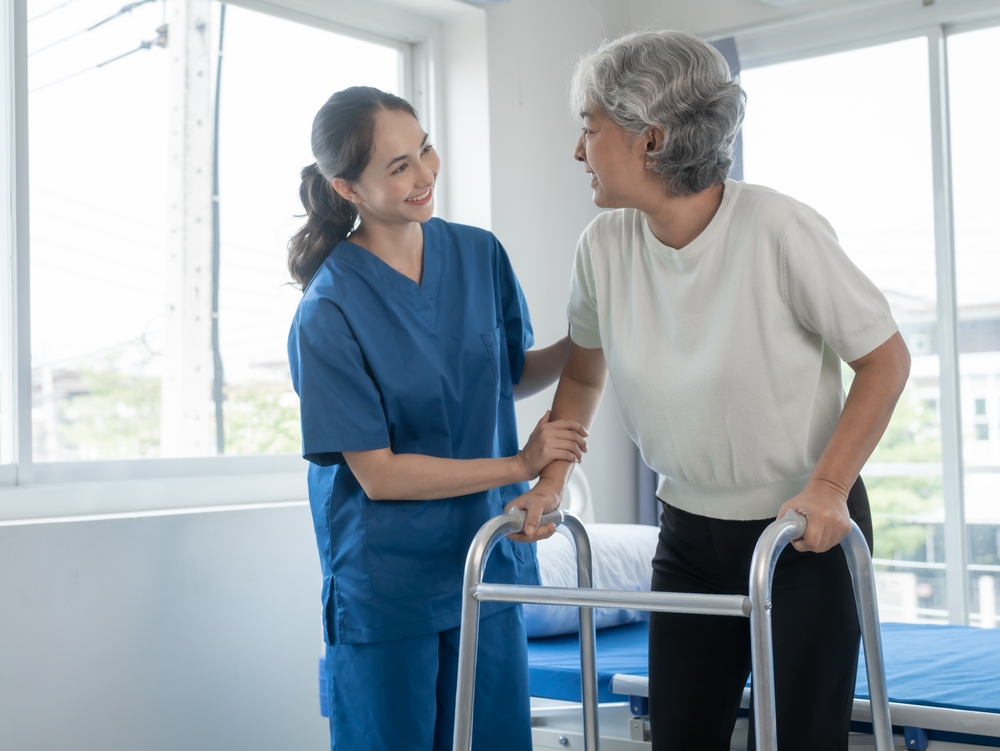 Nurse helping patient walk - United Personal Injury Care - Houston, TX