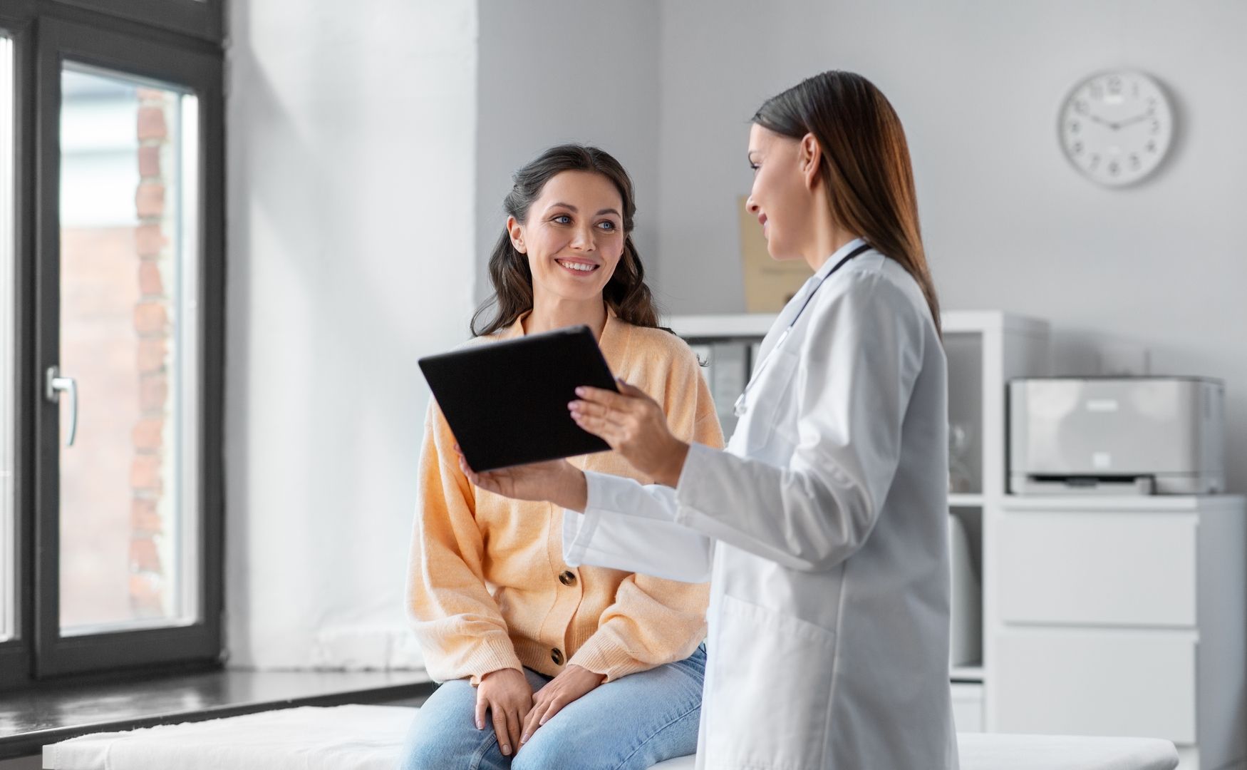 Doctor Showing Laboratory Results to Patient - United Personal Injury Care